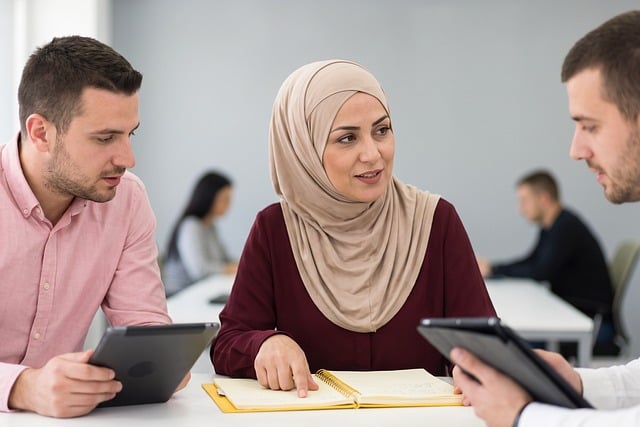유튜브 광고 수익 구조 이해하기: CPM과 RPM의 차이 - teamwork, meeting, office, teaching, professional, hijab, woman, man, tablet, notebook, dis